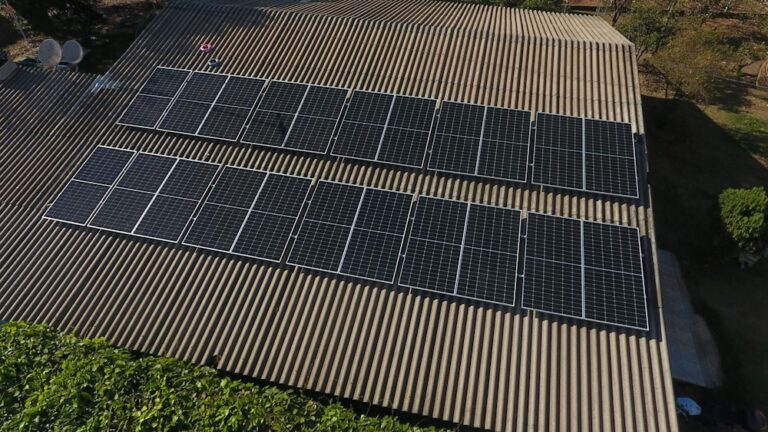 Solar panels installed in rows on a rooftop