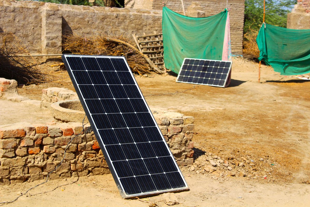 Portable off-grid solar panels set up in a rural yard